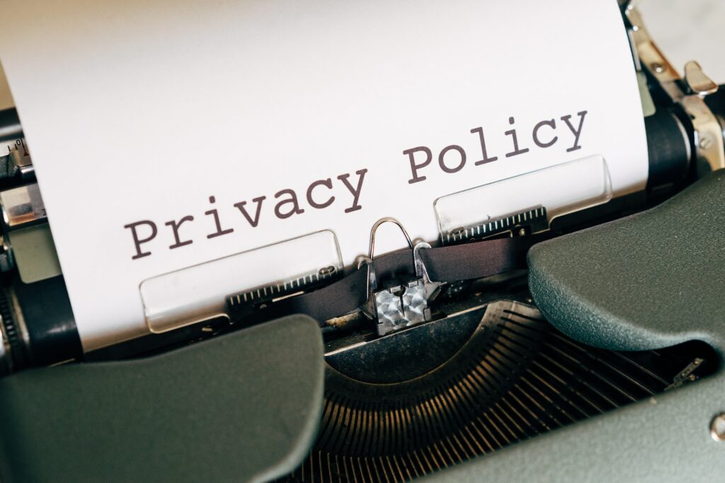 typewriter with a paper that reads privacy policy